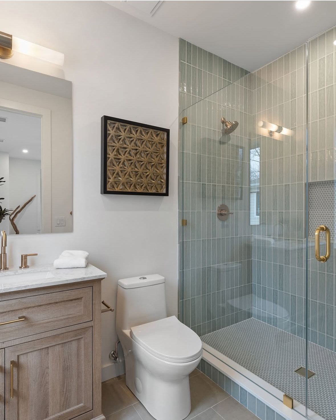 Squirrel Hill bathroom remodel — vertical glass tile shower with custom tile work